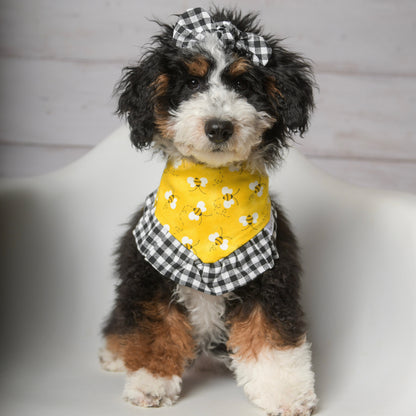 Back view of small dog modeling bee print yellow gingham dog bandana with ruffles